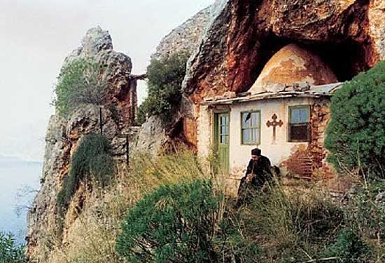 A hermit in front of his hut